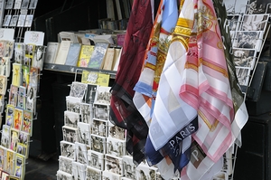Scarves and postcards for sale on the banks of the Seine River - Paris by Kevin Oke