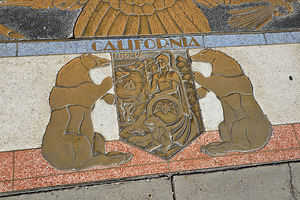 Bas relief plaque for California is inlaid into Hoover Dams plazas surface one of the seven states that fall within the Colorado Rivers basin. Hoover Dam Arizona Nevada USA