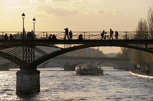People taking in the view from Pont des Arts. Paris by Kevin Oke