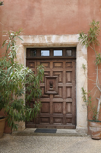Wooden door with door knocker. Roussillon. France by Kevin Oke