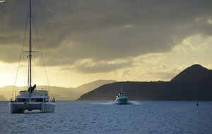Passenger ferry and anchored catamaran at Sopers Hole by Kevin Oke