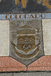 Bas relief plaque for Colorado is inlaid into Hoover Dams plazas surface one of the seven states that fall within the Colorado Rivers basin. Hoover Dam Arizona Nevada USA