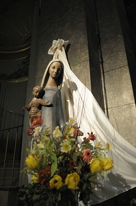 Wood carving of the virgin with bouquet of flowers Eglise Saint Pothin
