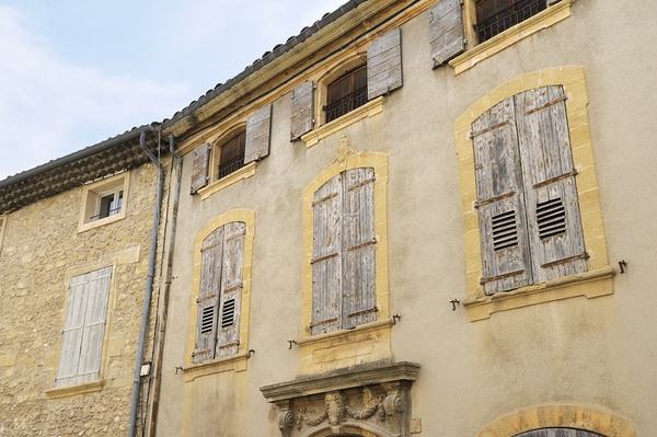 Shuttered windows on an old apartment  building in Lourmarin Print