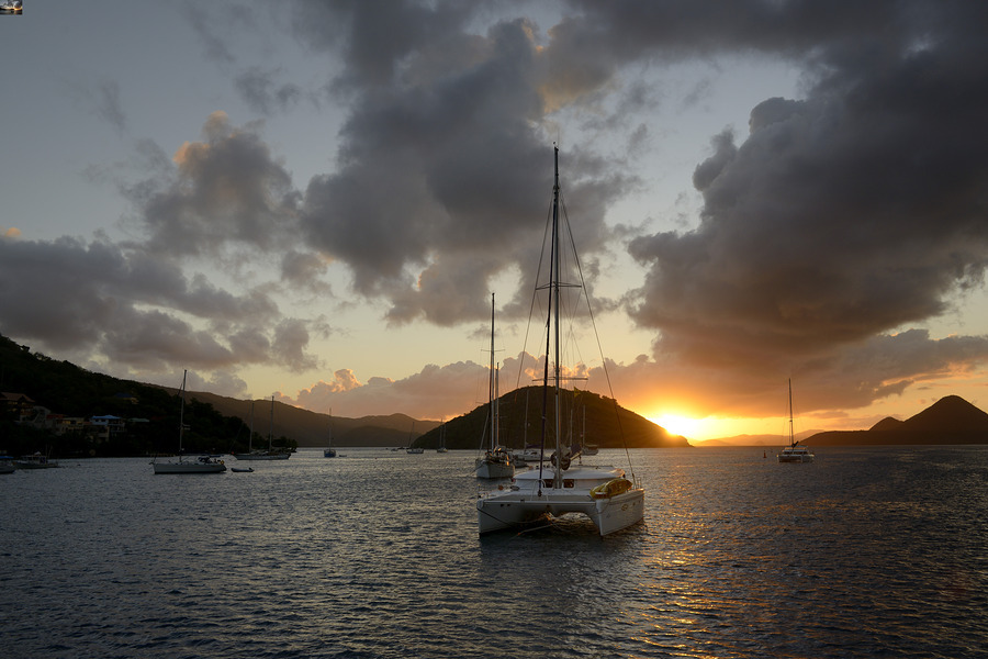 Caribbean sunset with catamarans and sailboats   Print