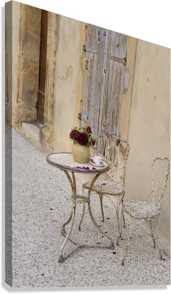 Outdoor table with flowers Canvas Print