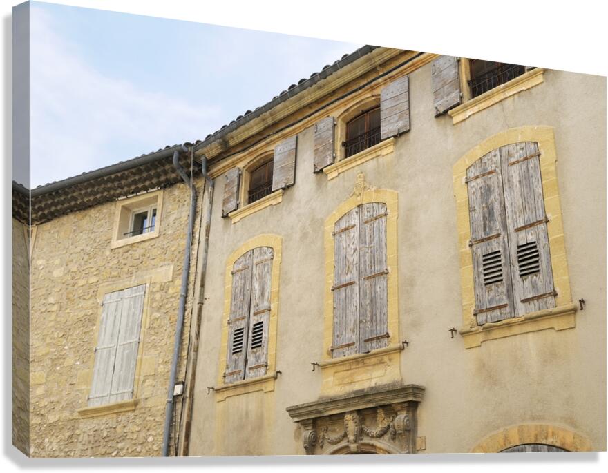 Shuttered windows on an old apartment  building in Lourmarin Canvas Print