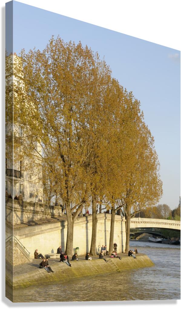 Enjoying a warm spring day on the banks of the Seine River - Paris Canvas Print