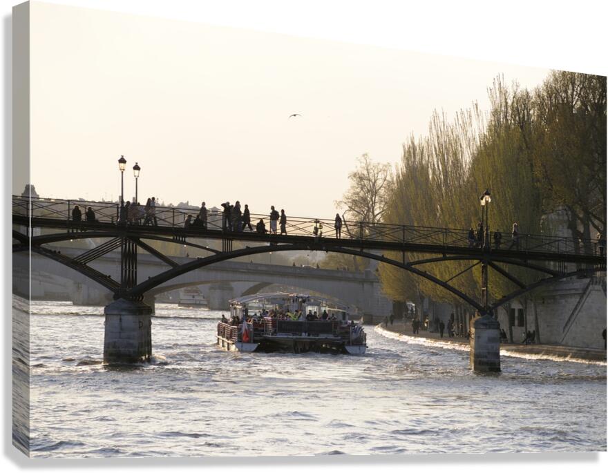 Tourist boat passing under Pont des Arts. Paris Canvas Print