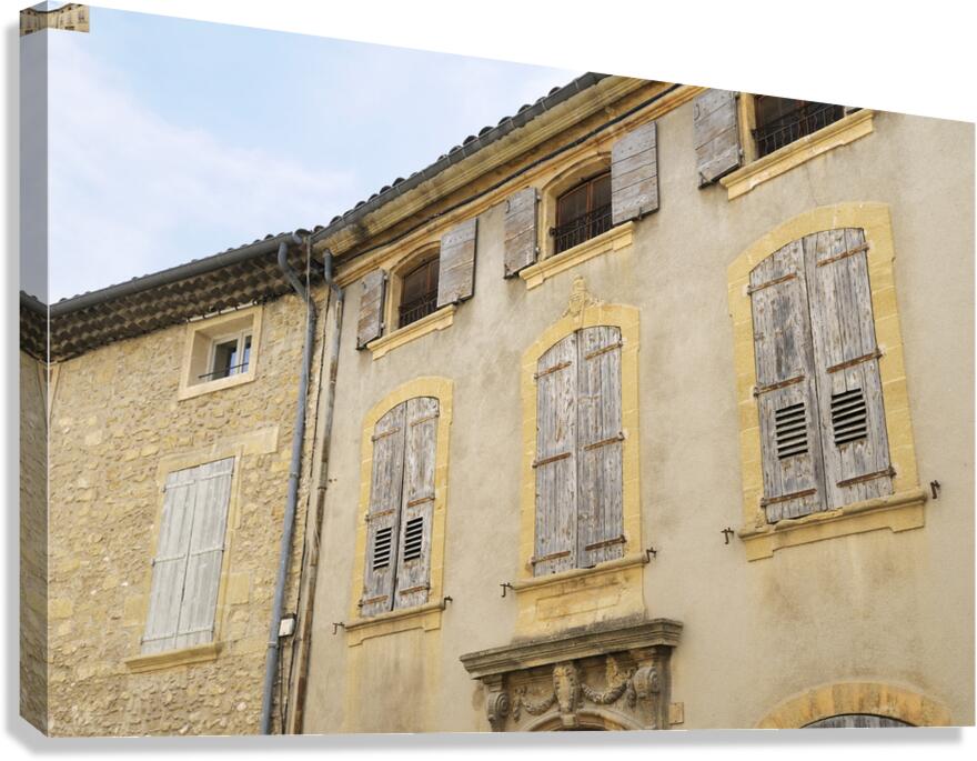 Shuttered windows on an old apartment  building Lourmarin Vaucluse Provence Alpes Côte dAzur France Canvas Print