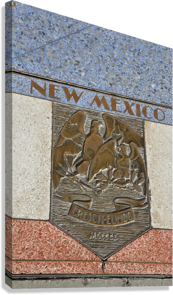 Bas relief plaque for New Mexico is inlaid into Hoover Dams plazas surface one of the seven states that fall within the Colorado Rivers basin. Hoover Dam Arizona Nevada USA Canvas Print