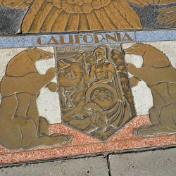 Bas relief plaque for California is inlaid into Hoover Dams plazas surface one of the seven states that fall within the Colorado Rivers basin. Hoover Dam Arizona Nevada USA
