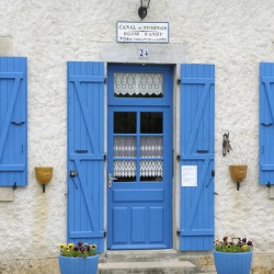 Blue door and shutters at the lock keepers house Ecluse 24 Anizy Champ du Pont Limanton Nievre Burgundy France