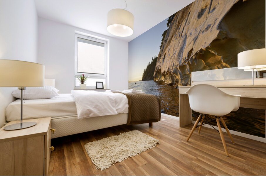 Sea kayaking under the sculpted sandstone cliffs Mural print