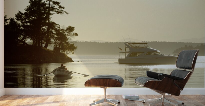 Couple in a dinghy rowing in front of a pleasure motorboat Wall Murals