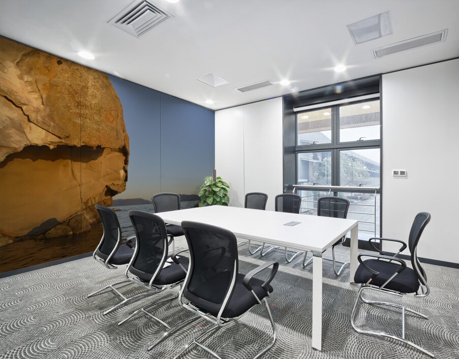 Sea kayaking under sculpted sandstone cliffs Wall Printing