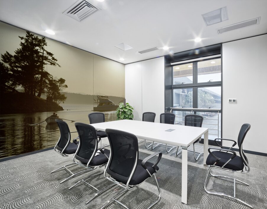 Couple in a dinghy rowing in front of a pleasure motorboat Wall Printing