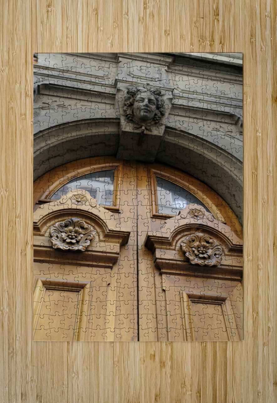 Wooden door with carved figurine in stone above it. France Kevin Oke Puzzle printing