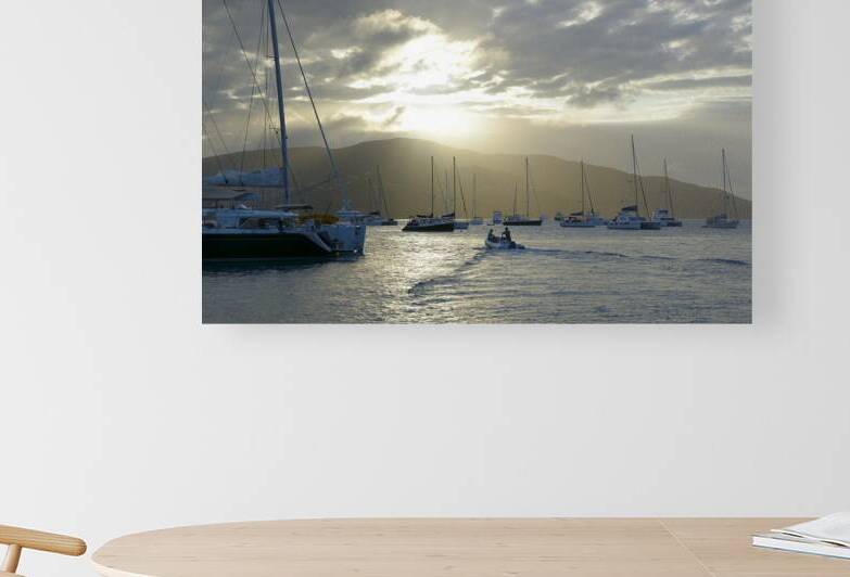 Dinghy heading out to the anchorage by Kevin Oke