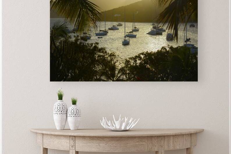 Catamarans and sailboats at the anchorage at Pussers Marina Cay by Kevin Oke