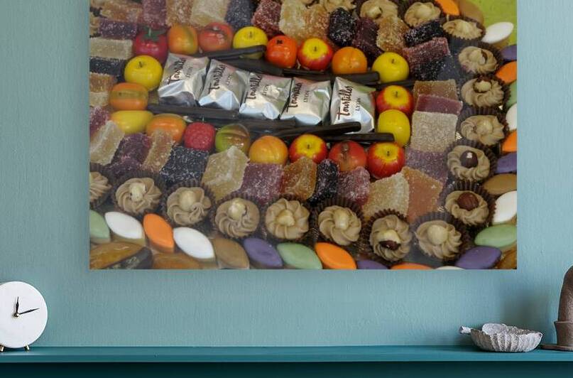 Sweets for sale in a local shop window by Kevin Oke