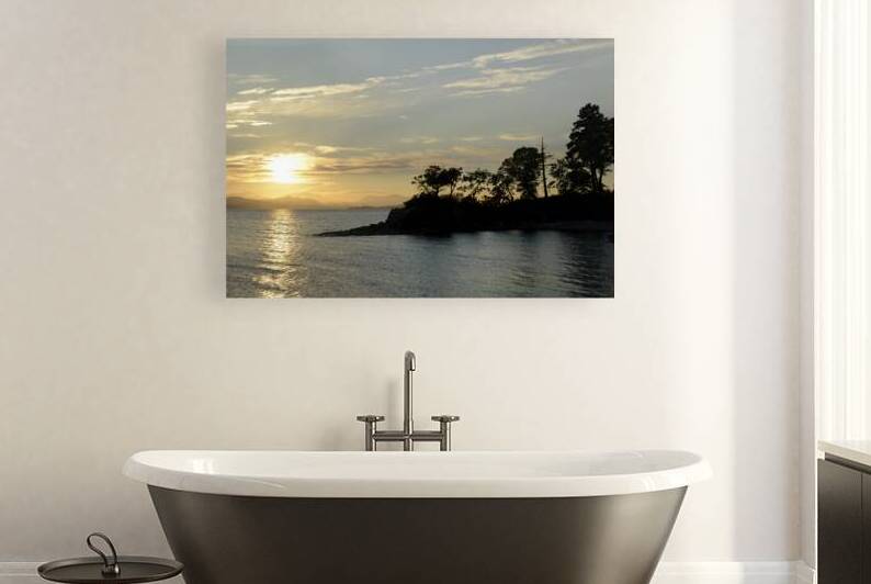 Sunset over Vancouver Island with silhouetted trees by Kevin Oke