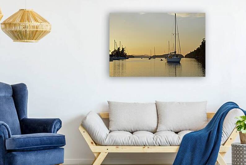 Sea kayaker and anchored boats in Princess Bay by Kevin Oke